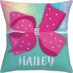 a pillow with a pink bow on the front and words that says,'haley '