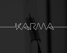 the word karma written in white on a black background