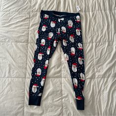 Christmas Pajama Pants From Old Navy. Legging Style. 100% Cotton Fabric Is Soft And Stretchy And Can Be Machine Washed And Dried. Cute Santa Print (These Are The Santas With A Tan)! Size Xl. Brand New With Tags. Waist Is 18.5 Inches Laying Flat And Inseam Is 29 Inches. Casual Long Pants For Holiday, Christmas Bedtime Long Bottoms, Cotton Lounge Pants For Christmas, Cotton Pants For Christmas Loungewear, Christmas Cotton Sleep Pants, Casual Holiday Sleepwear With Long Pants, Christmas Cotton Loungewear Bottoms, Christmas Loungewear Long Pants, Casual Christmas Sleep Bottoms