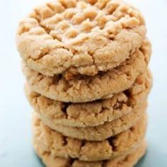 a stack of cookies sitting on top of a blue countertop next to each other