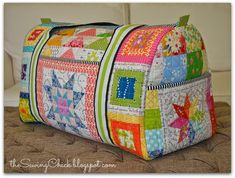 a colorful patchwork purse sitting on top of a couch