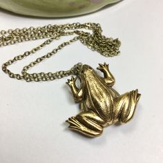 "Solid brass frog locket. Small tear shaped locket hidden behind the body. Frog measures 1\" by 1 1/4\" and has nice detail and dimension. Frogs symbolize spiritual cleansing and prosperity. In addition, they are beautiful creatures that help us tend our gardens! Nice solid brass chain that will close off with a brass lobster clasp. You may choose a custom length in the drop down menu above. The perfect gift for the frog lover in your life! I offer quick shipping and all packages arrive ready fo Secret Compartment Necklace, Garden Frog, Unique Locket, Bee Wings, Beetle Wings, Garden Frogs, Handwritten Gifts, Animal Spirit, Spiritual Cleansing