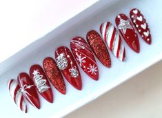 Red Christmas Handpainted False nails set on long stiletto shape. * Available in any shape & length. * Available in set of 10 nails and full set of 20 nails. All nail sets are handpainted, made with high quality salon products and genuine crystals. Some of nail sets have handpainted drawings. * Each order set includes nail prepare kit - mini nail file , storage gift box with a ribbon, 12 adhesive tabs. If you have any questions feel free to send me a message. ^^ Disclaimer. * Actual colors may v Christmas Nail Art Designs Snowflakes Red, Xmas Red Nails Christmas Design, Christmas Nails Elegant Red, Christmas Ball Nails, Red Bling Christmas Nails, Christmas Press On Nail Designs, Festive Nails Christmas Sparkle, Red Rhinestone Christmas Nails, Christmas Present Nail Designs