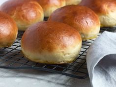 several rolls on a cooling rack ready to be baked in the oven or used as bread