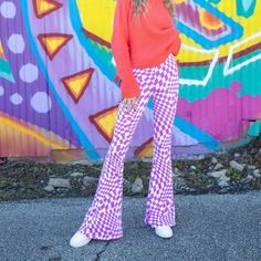 Your Favorite Flare Pants Meet Your Favorite Pattern. Checkers Are Trending With No Signs Of Stopping! So Snag These Checkered Flare Pants While You Can! They Are Extremely Stretchy And Soft To The Touch. Pair With Your Favorite Oversized Sweaters And Tees! Seen Paired With The On The Road Sweater. True To Size. 96% Poly 4% Spandex Model Is 5'7 Wearing A Size Small. Purple Checkered Pants Outfit, Trendy White Flare Bottoms, Retro White Pants For Fall, Trendy White Fall Leggings, White Stretch Retro Bottoms, Chic Stretch Plaid Bottoms, White Stretch Retro Pants, White Retro Stretch Pants, Retro White Stretch Pants