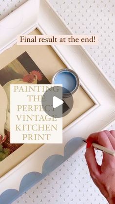 a person holding a paintbrush in front of a painting with the words'paint the perfect vintage kitchen print '