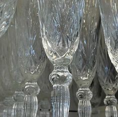 an assortment of crystal wine glasses lined up