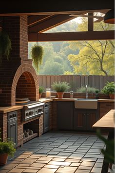 Morning light on rustic outdoor kitchen next to vegetable garden Outdoor Mexican Kitchen, Patio Budget, Farmhouse Outdoor Kitchen, Kitchen Cost, Kitchen Surface, Brick Pizza Oven, Farmhouse Patio, Farmhouse Outdoor, Patio Kitchen