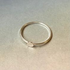 This listing is for sterling silver Ring blank with 4mm disk on top, This ring blank is ideal for glue-on design. Use two-parts jeweler glue, resin, or gel crazy glue for best results The ring is made with 18 flat  wire, measures approx. 1.1mm in width. A minimalist ring that looks great alone or with other stackable rings. You can purchase different number of rings in each order. If ordered multiples, each ring can be a different size. https://www.etsy.com/ca/shop/GemsFromMyHeart Thanks for vis Handmade Minimalist Round Band Jewelry, Minimalist Handmade Jewelry With Round Band, Handmade Minimalist Round Band Rings, Minimalist Handmade Rings With Round Band, Minimalist Handmade Round Band Ring, Modern Handmade Round Rings, Minimalist Nickel Free Round Band Ring, Handmade Minimalist Midi Rings With Round Band, Minimalist Nickel-free Round Band Ring