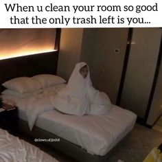 a person in a white robe sitting on a bed with the caption, when u clean your room so good that the only trash left is you