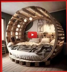 a circular bed made out of wooden pallets in a room with red frame around it