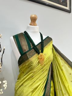 Discover the timeless beauty of our high-quality Banarasi saree, perfect for any occasion(wedding or parties). An apt pick for wedding or any kind of occasion. Very high quality, soft and pleats well. This set is completed with an unstitched blouse fabric. Green Chanderi Pre-draped Saree For Puja, Festive Green Paithani Silk Pre-draped Saree, Elegant Green Pre-draped Saree For Festivals, Green Lehenga With Saree Pallu, Green Handloom Chanderi Pre-draped Saree, Elegant Green Handloom Pre-draped Saree, Festive Green Pre-draped Saree With Zari Weaving, Elegant Green Saree For Festivals, Green Unstitched Banarasi Silk Lehenga