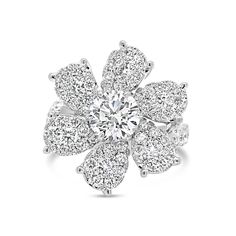 The only thing better than a natural flower is a natural diamond flower. Featuring a 1.03 ct diamond surrounded by pave diamond petals, this eye-catching piece beams with the brightness of springtime. -18K gold weighing 6.78 grams -1.03 ct round brilliant-cut diamond (GIA-graded F color, I1 clarity) -6 round diamonds totaling 0.30 carats -60 round pave-set diamonds totaling 1.08 carats Available in yellow, white, and rose gold. Please allow 4-6 weeks for delivery if item is not in stock. Item no Diamond Flower Ring, Diamond Engagement Rings Cushion, Cushion Halo Engagement Ring, Diamond Bar Necklace, Round Halo Engagement Rings, Oval Diamond Engagement, Oval Diamond Engagement Ring, Engagement Ring Diamond Cut, Gold Bar Necklace