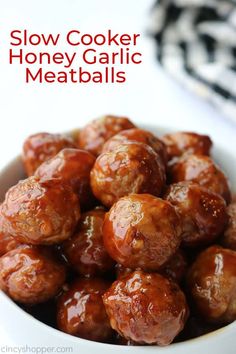 slow cooker honey garlic meatballs in a white bowl with the title above it