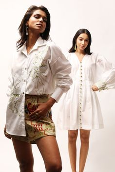 White cotton poplin shirt with thread embroidery.
Components: 1
Pattern: Embroidered
Type Of Work: Thread
Neckline: Spread collar
Sleeve Type: Full
Fabric: Cotton poplin
Color: White
Other Details: 
Closure : Front buttons
Note : Shorts and Outfit worn by the model on the right are not for sale.
Occasion: Party - Aza Fashions Collar Shirt For Women, Cotton Poplin Shirt, Thread Embroidery, Fashion App, Shirt For Women, Online Tops, Collar Shirt, Poplin Shirt, Embroidered Shirt