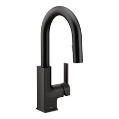 the black faucet is mounted on the wall, and it has an angled spout