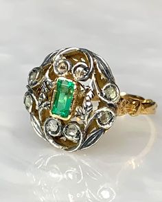 Oval Emerald Ring, Vintage Emerald Ring, Rose cut Diamond Ring, Emerald Gold Ring, Antique Emerald Ring, Emerald Leaf Ring, OOAK Ring A pleasing unusual 18k yellow gold one of a kind piece featuring a 0.80 carat emerald cut Emerald surrounded by rose cut diamonds accented with genuine silver. *Approximate ring weight: 5.65 grams * Ring size: US 8 1/2 Heirloom Emerald-cut Ring With Single Cut Diamonds, Heirloom Emerald Cut Ring With Single Cut Diamonds, Vintage White Gold Emerald Ring With Diamond Cut, Antique Hallmarked Emerald Ring In White Gold, Luxury White Gold Emerald Ring With Rose Cut Diamonds, Luxury Emerald Ring With Rose Cut Diamonds For Anniversary, Oval Emerald Ring With Single Cut Diamonds For Anniversary, Antique Emerald Rings With Rose Cut Diamonds, Luxury Emerald Rings With Rose Cut Diamonds