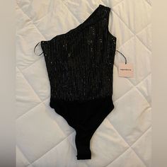 Brand Is Super Down From Revolve. Never Worn New With Tags Size Xs. Black Is Out Of Stock On The Website So The Bodysuit On The Model Is Gold. Glamorous Black Stretch Bodysuit, Black Sequin Bodysuit For Party, Glamorous Fitted Black Bodysuit, Black Sequined Party Bodysuit, Fitted Black Bodysuit With Sequins, Fitted Black Sequin Bodysuit, Glamorous Black Summer Bodysuit, Sleeveless Black Glamorous Bodysuit, Glamorous Black Sleeveless Bodysuit