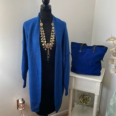 This Royal Blue Color With A Bit Of Black Cardigan Sweater Is Perfect For Winter. Measures 24 From Underarm To Underarm And 36 From Shoulder To End Of Garment. Made Of Acrylic And Polyester It Is Both Warm And Easy To Wash. Purchased This Year But Never Wore. New Without Tags. Size Is Xl Bit I Removed Tag. See Measurements. Blue Open Front Sweater For Fall, One Size Blue Trendy Cardigan, Trendy Blue Cardigan, Trendy Blue One Size Cardigan, Blue Open Front Sweater For Layering, Blue Open Front Layering Sweater, Fall Blue Cardigan For Day Out, Oversized Blue Cardigan For Work, Trendy Blue Open Front Cardigan