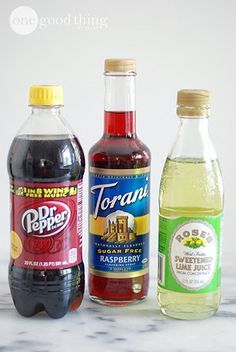 three different types of soda on a table