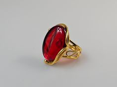 Red Amber ring, ruby red Baltic Amber. Gold plated adjustable ring. Easy resize just by pressing it. Oval shape red ring.  Small  gift Idea.  Gemstone size 2,8 × 2 cm Weight 8,16 gr Handmade of processed genuine yellow amber. Painted gemstone. Red Rings For Valentine's Day Formal Occasion, Formal Red Rings For Valentine's Day, Red Valentine's Day Rings For Formal Occasions, Adjustable Red Oval Ruby Ring, Adjustable Oval Red Ruby Ring, Red Open Ring For Valentine's Day, Adjustable Red Formal Jewelry, Adjustable Oval Red Ring, Adjustable Red Oval Ring