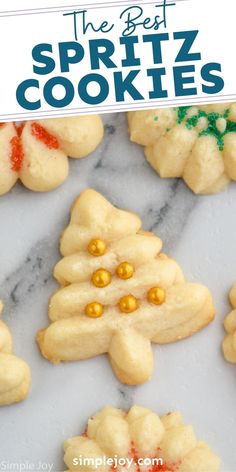 the best spritz cookies are on display in front of a white marble counter