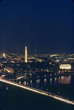 an aerial view of the washington monument at night