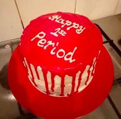 a red cake with white frosting that says happy birthday and periodd on it