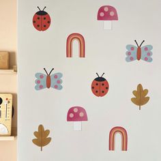 children's wallpaper with ladybugs, mushrooms and rainbows on it