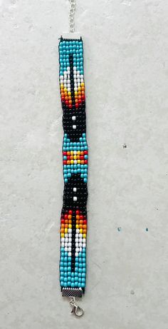 This handmade Native American inspire loom beaded arm/bracelet is made to order. This can extend to 8" in length. Black Woven Beaded Bracelets For Festival, Handmade Black Southwestern Beaded Bracelets, Black Beaded Southwestern Bracelets, Handmade Southwestern Black Beaded Bracelets, Southwestern Black Beaded Bracelets, Handwoven Black Beaded Bracelets For Festival, Black Handwoven Beaded Bracelets For Festivals, Southwestern Style Black Beaded Bracelets, Black Handwoven Beaded Bracelets