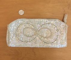 "Elegant La Ragale sequin and faux pearls clutch with metal zipper and cream faille interior. Purse is in excellent condition, interior has a couple of pink spots inside(see pic). Height 4.5\" Width 9\" Thickness 1/2\" Vintage garments have been previously worn and lovingly cared for, they may however have a blemish or two. Here at MadelonVintage, I try my very best to note all the details of each garment, although I may sometimes overlook things, which I do apologise for. Please do not expect p Elegant Clutch With Zipper Pouch For Formal Events, Party Clutch With Zipper Pouch, Pearl Clutch, Sequin Clutch, Beautiful Skirts, Blue Wool, Metal Zipper, White Beads, Black Button