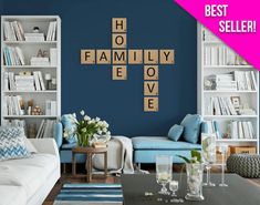 a living room filled with furniture and a crossword puzzle on the wall above it