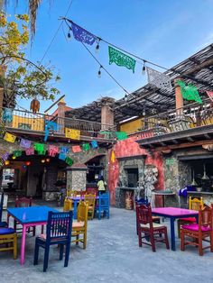 colorful tables and chairs are set up outside