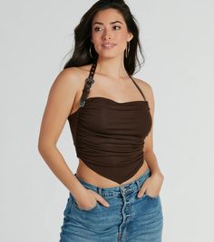 Perfect for festivals, concerts, or nights out with friends, this statement halter top brings the Wild West anywhere you go. It features a faux leather adjustable belted halter strap with buckle closure, western metal trim, side ruched seams that define your curves, and a fitted crop hem soft lined knit fabric. Complete the look in trendy denim shorts and boots.Fit & FeaturesSoft-lined knit stretchy fabricFaux leather adjustable halter strap, buckle closureWester metal trimSide ruched seamsF Fitted Brown Halter Top For Festivals, Trendy Fitted Halter Top For Festival, Trendy Club Halter Top, Festival Halter Top With Adjustable Straps, Trendy Halter Neck Top For Club, Chic Brown Halter Top For Night Out, Trendy Fitted Halter Top For Music Festival, Brown Halter Top For Summer Party, Brown Summer Party Halter Top