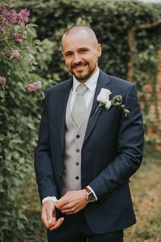 groom in navy three piece suit Navy Suit Waistcoat, Navy Suit With Vest Wedding, Blue Suit Green Waistcoat, Navy And Green Groom, Grooms Suit Navy Blue, Navy And Sage Suit Wedding, Navy Suit Grey Waistcoat Wedding, Grooms Man Suits Wedding Ideas