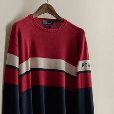 Part of the Spring 1992 Polo Stadium collection. Striped cotton sweater with our “Polo” logo at the left sleeve. Size large has approximately a 25.75" back body length a 23.25" shoulder a 46.5" chest and a 25.75" sleeve length. Vintage Polo Sweater With Ribbed Crew Neck, Vintage Crew Neck Polo Sweater, Vintage Polo Sweater With Ribbed Collar And Crew Neck, Vintage Cotton Polo Sweater With Crew Neck, Vintage Cotton Crew Neck Polo Sweater, Ralph Lauren Cotton Long Sleeve Sweater, Ralph Lauren Long Sleeve Sweatshirt For Streetwear, Ralph Lauren Crew Neck Fall Sweater, Ralph Lauren Fall Crew Neck Sweater