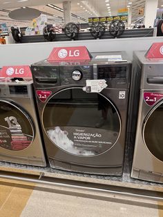 several washers are on display in the store for $ 10 each and one is empty