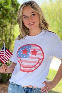 This tee is sure to brighten your day! Pair it with denim shorts and you are ready to face the day! Patriotic Graphic Print T-shirt For Summer, Trendy Short Sleeve T-shirt For 4th Of July, White Patriotic T-shirt With Screen Print, Patriotic Short Sleeve T-shirt For Memorial Day, Patriotic Short Sleeve T-shirt With Text Print, Patriotic Tees, Patriotic Shirts, Cotton Tank Top, Color Shorts