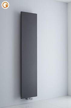 a radiator in the corner of a room with white walls and flooring