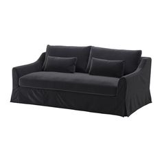 a black couch with four pillows on it's back and one arm folded up