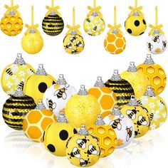 a bunch of yellow and black ornaments are arranged in the shape of a honeycomb