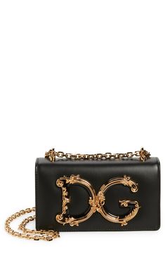 A D&G logo with baroque-inspired gilt flourishes ornately brands this compact leather bag designed with a sliding chain strap that can be worn doubled or long. Magnetic-snap flap closure Pull-through chain strap Interior card slot Leather lining Leather Made in Italy Designer Handbags Leather Bag Design, Dolce E Gabbana, Mini Crossbody Bag, Black Tote, Mini Crossbody, Printed Bags, Black Cross Body Bag, Dolce & Gabbana, Leather Mini