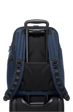 Modern and versatile, this spacious backpack outfitted with plenty of pockets is made from ballistic nylon for lasting durability. 16 1/2"H x 11"W x 6 1/2"D. (Interior capacity: large.) Top carry handle; adjustable backpack straps Padded compartment fits most 15" laptops Key leash Luggage sleeve This bag includes Tumi Tracer®, an exclusive, complimentary program that helps reunite lost or stolen bags with their rightful owners using a one-of-a-kind 20-digit number affixed to the bag Ballistic ny Business Nylon Backpack Luggage, Nylon Business Backpack, Nylon Backpack Luggage With Functional Pockets, Nylon Backpack With Functional Pockets, Nylon Backpack With Multiple Pockets For Trip, Functional Nylon Backpack For Business Trips, Classic Nylon Backpack For Outdoor, Classic Outdoor Nylon Backpack, Backpack Outfit