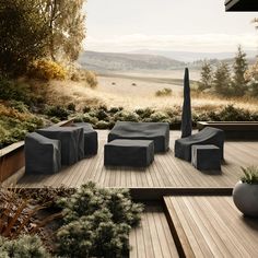 an outdoor seating area with wooden decking and plants