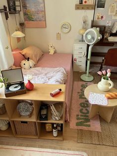 a room with a bed, desk and other items