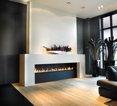 a modern fireplace in the middle of a living room