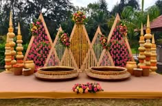 an elaborately decorated stage with flowers and candles