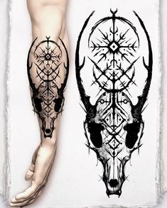 an artistic tattoo design on the leg of a man's arm and calf skull