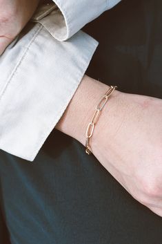 Our Paperclip Collection brings statement pieces into your everyday lineup - even if you're not a statement-jewelry-kinda-person. This beaut is lightweight & breezy while maintaining a bold presence. The Paperclip Bracelet is made from 14k Gold-Filled chain, which means you can live real life in this bracelet without fear of it turning or tarnishing. 14k Gold-Filled 7" length, one size fits most handmade in dallas, tx Hypoallergenic A tip from our team: this bracelet looks stunning paired wi Chic Metal Paperclip Jewelry, Elegant Metal Paperclip Bracelet With Oval Links, Elegant Sterling Silver Paperclip Bracelet With Adjustable Chain, Elegant Sterling Silver Paperclip Bracelet With Rectangular Links, Modern Everyday Gold Bracelet With Box Chain, Elegant Oval Link Bracelets For Everyday, Elegant Oval Link Bracelet For Everyday, Elegant Metal Paperclip Bracelet, Everyday Sterling Silver Gold Bracelet With Adjustable Chain