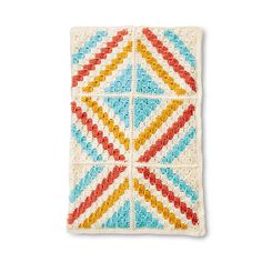 a crocheted square with different colors on it